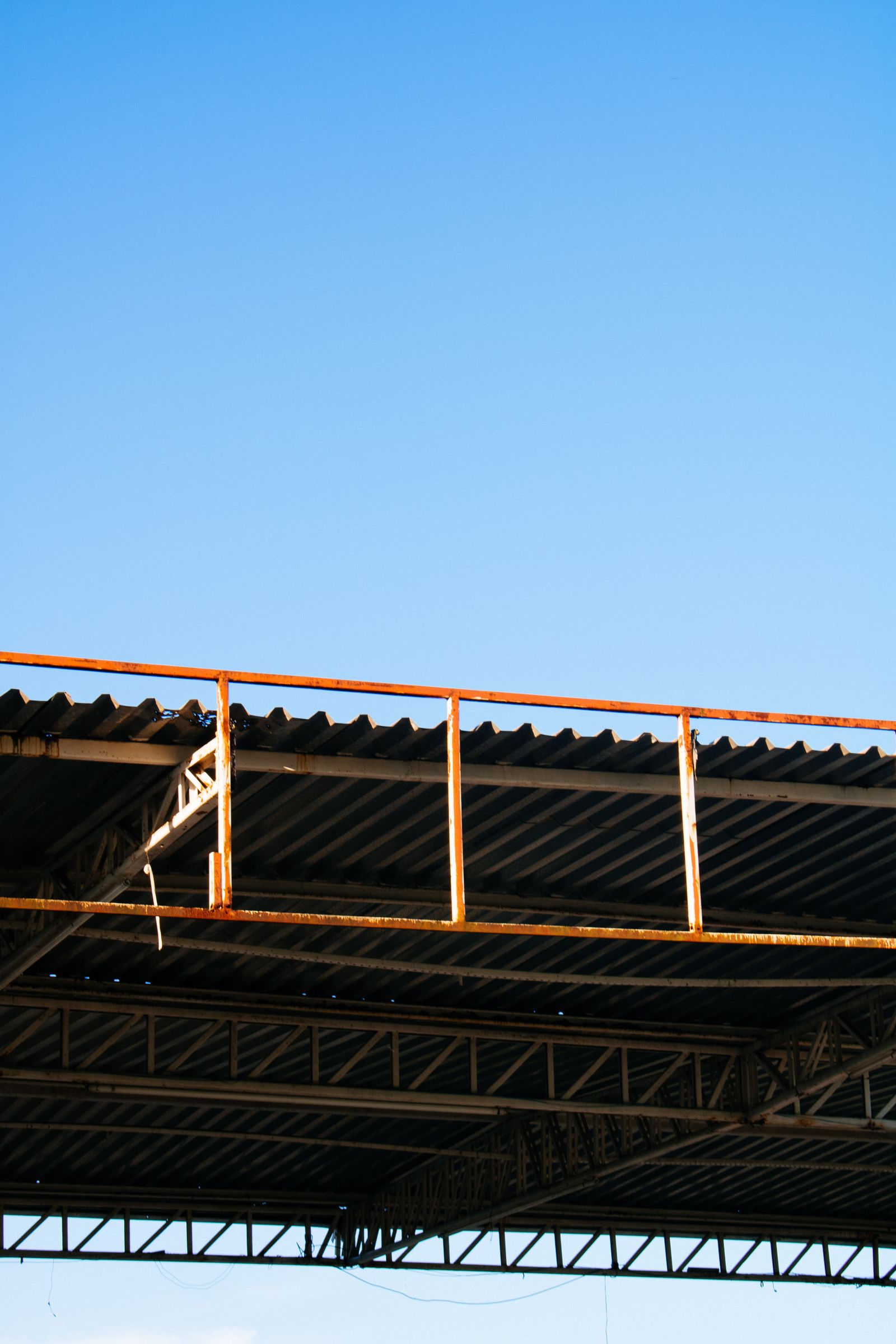 Minimalistic view of an industrial rooftop and clear sky, ideal for construction themes.