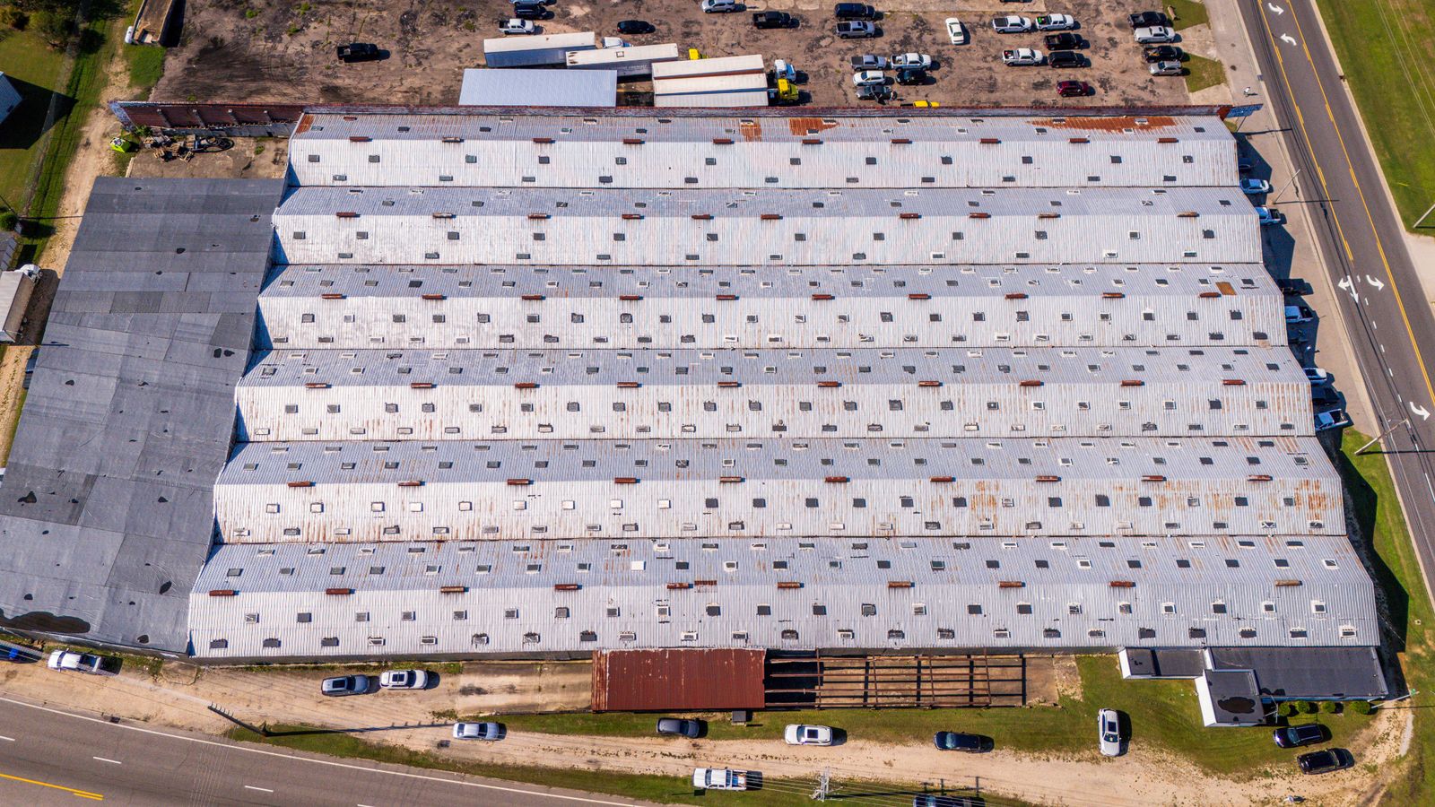 Aerial view of a large industrial warehouse roof